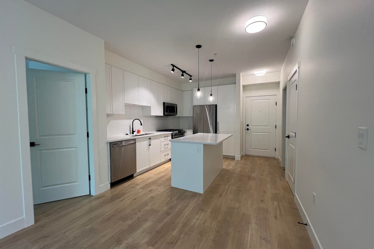 208 – 7506 199A Street — bright Willoughby condo interior.